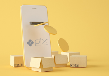 celular saindo moeda digital com o logo do pix
